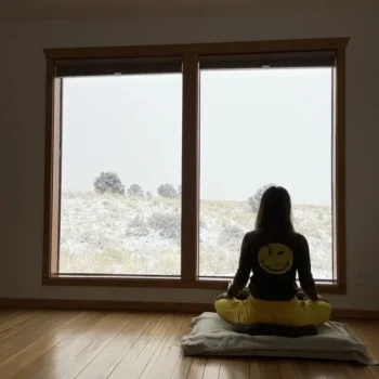 Natalia Bojanic Meditates In Her Cabin Facing Snowy Window